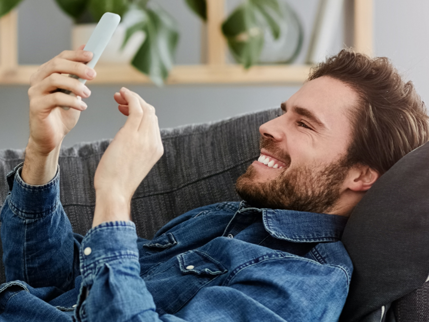 man with mobile phone using simple checking personal checking account